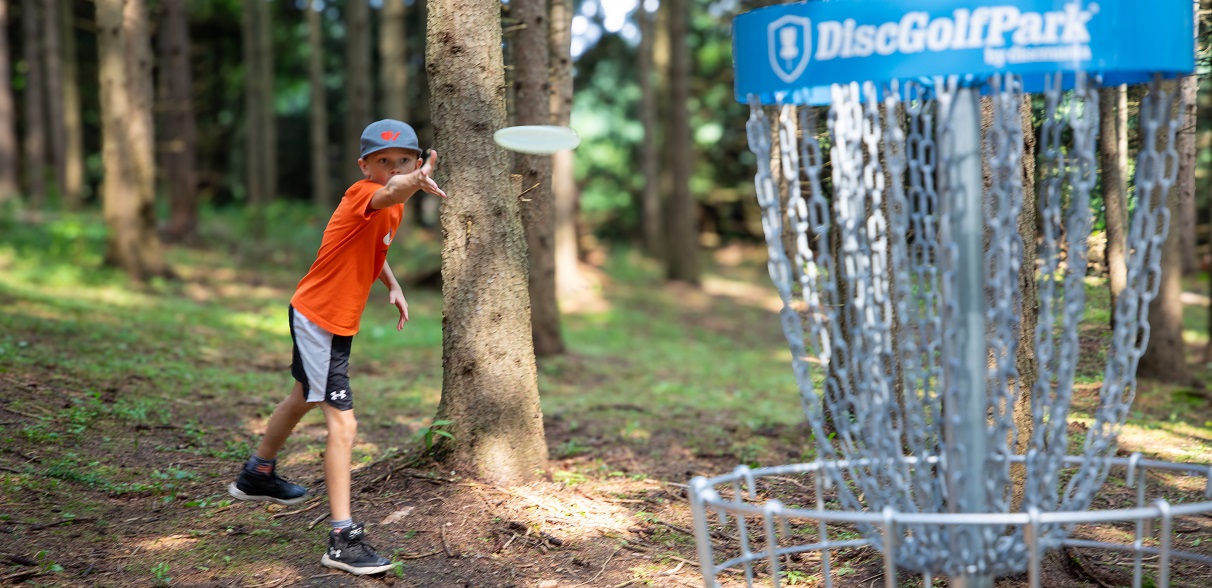 student takes part in a disc golf overnight camp at Albion Hills Conservation Park