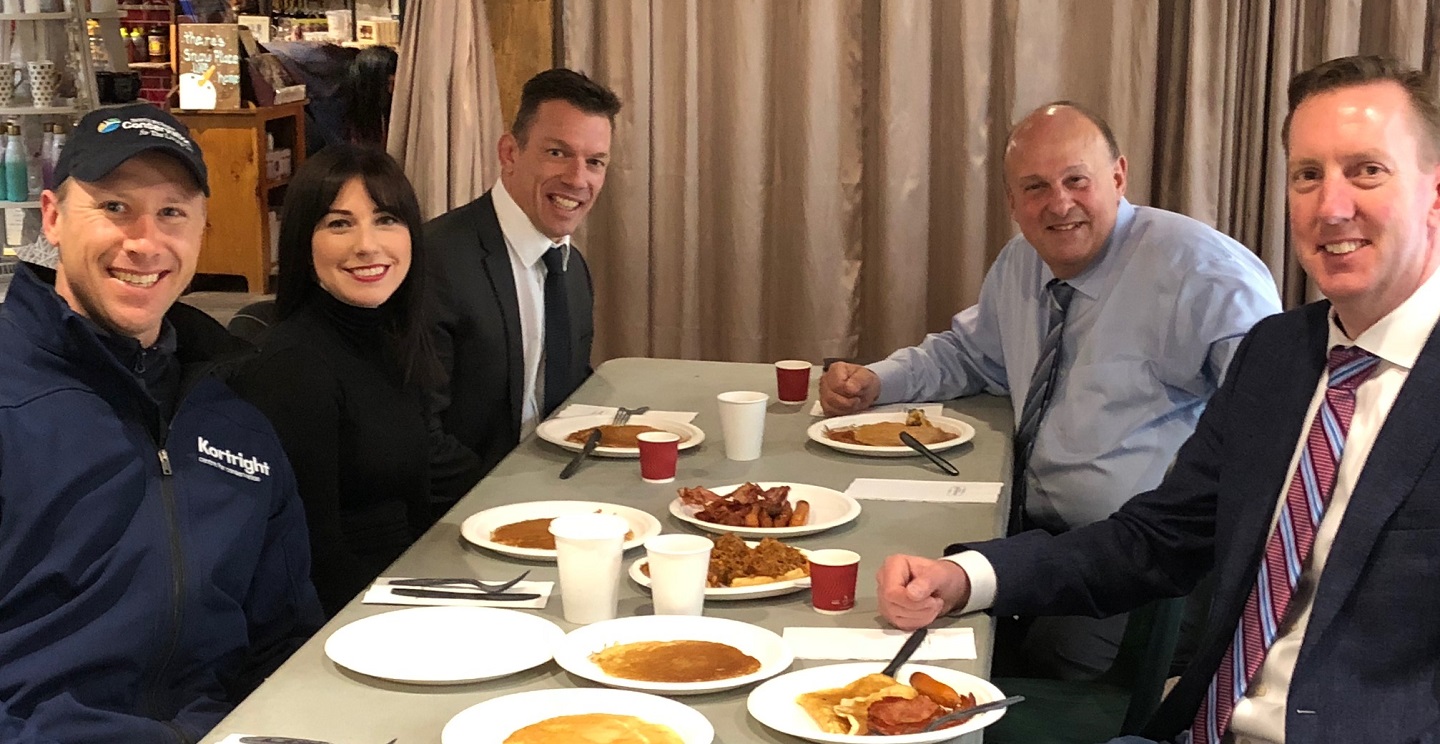 Minister Michael Tibollo enjoys pancakes with maple syrup during visit to Kortright Centre