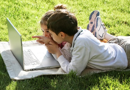 children outdoors with laptop participate in fun virtual summer camp activities from TRCA