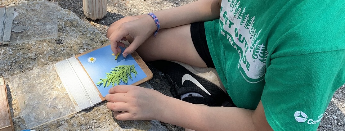 young girl takes part in crafting activity as part of TRCA virtual summer camp