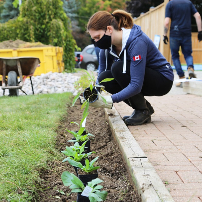 West Bolton SNAP Green Home Makeover homeowners and neighbours plant a pollinator garden