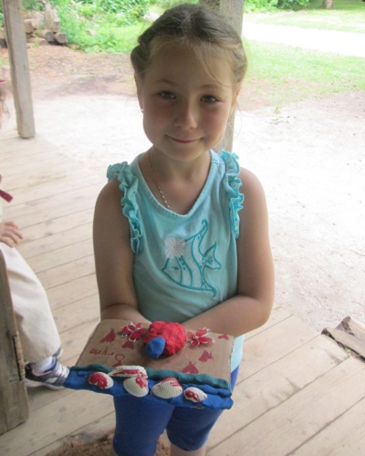 summer camper makes clay art at Black Creek Pioneer Village