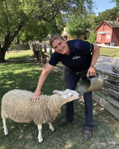 Black Creek Pioneer Village team member introduces summer campers to heritage breed sheep