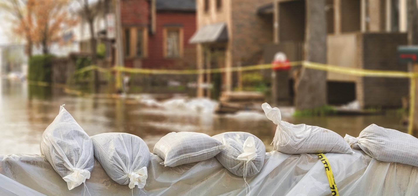 sandbag barrier on flooded surburban street