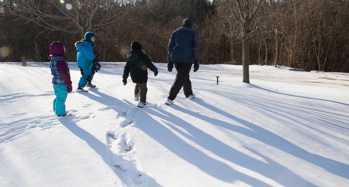 teacher and students explore Claireville Conservation Area in winter