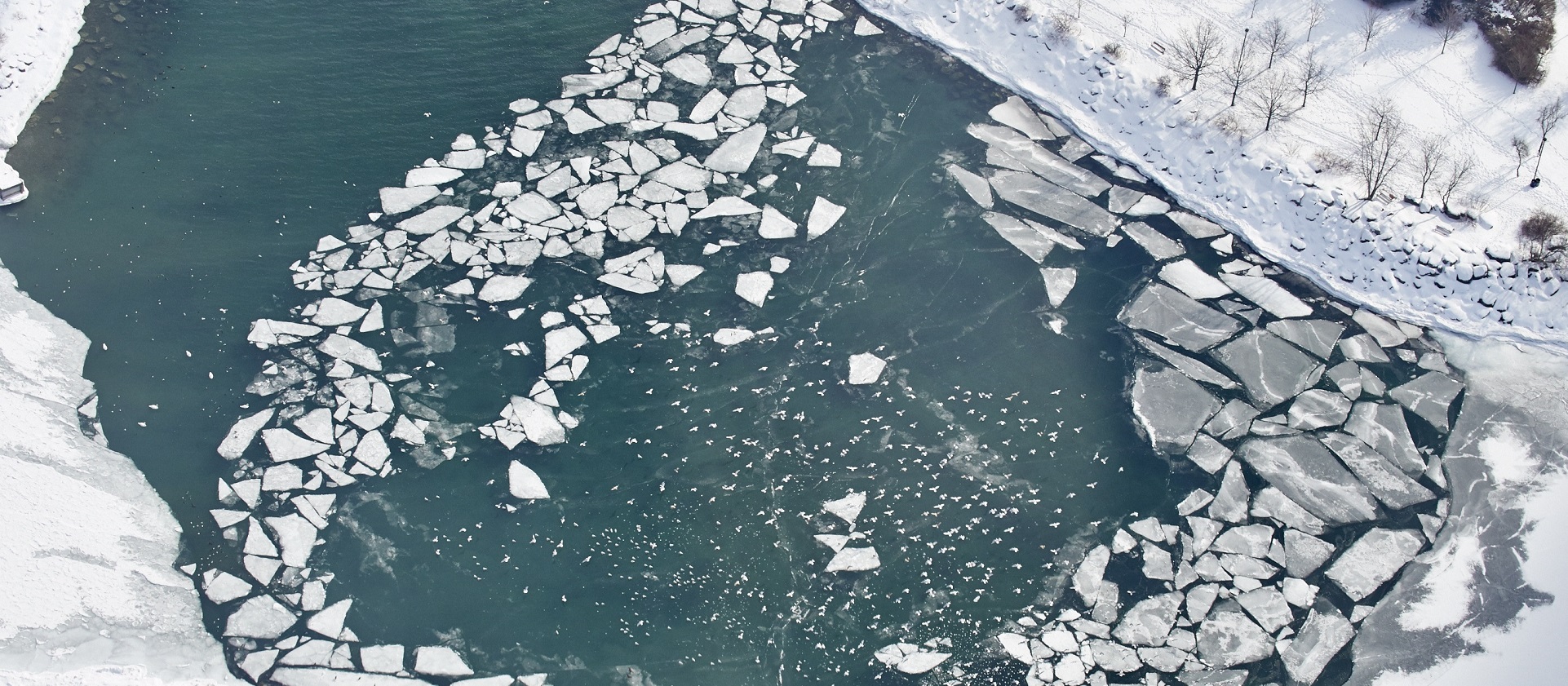 aerial view of an ice covered river in spring