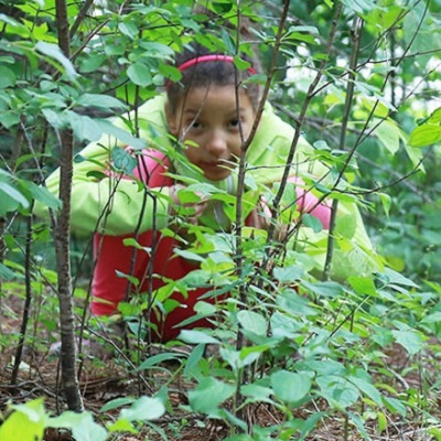 girl mimics animal survival techniques during birthday party at Claireville Conservation Area