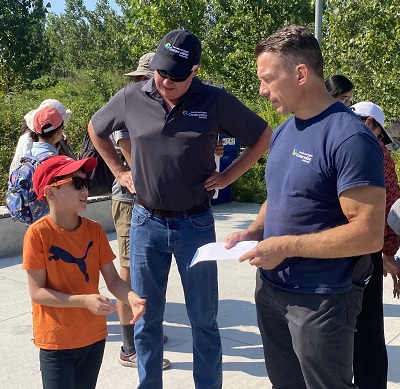 Evan Huynh with TRCA chair Paul Ainslie and CEO John MacKenzie 