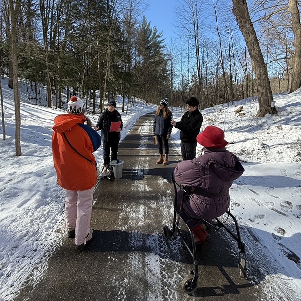 visitors to Kortright Centre for Conservation enjoy a guided tour of the maple syrup trail