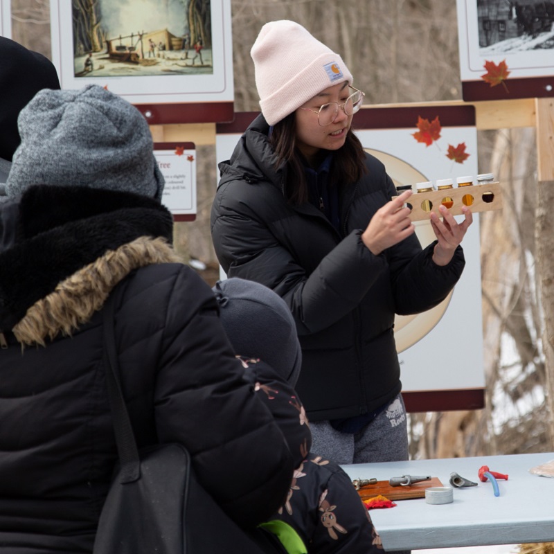 an educator at the Kortright Centre for Conservation delivers a presentation for visitors to the Sugarbush Maple Syrup Festival
