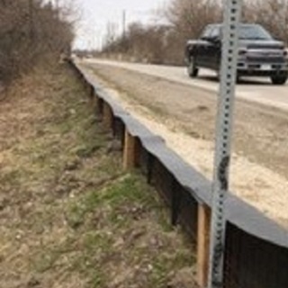 wildlife fencing installed at the side of a road