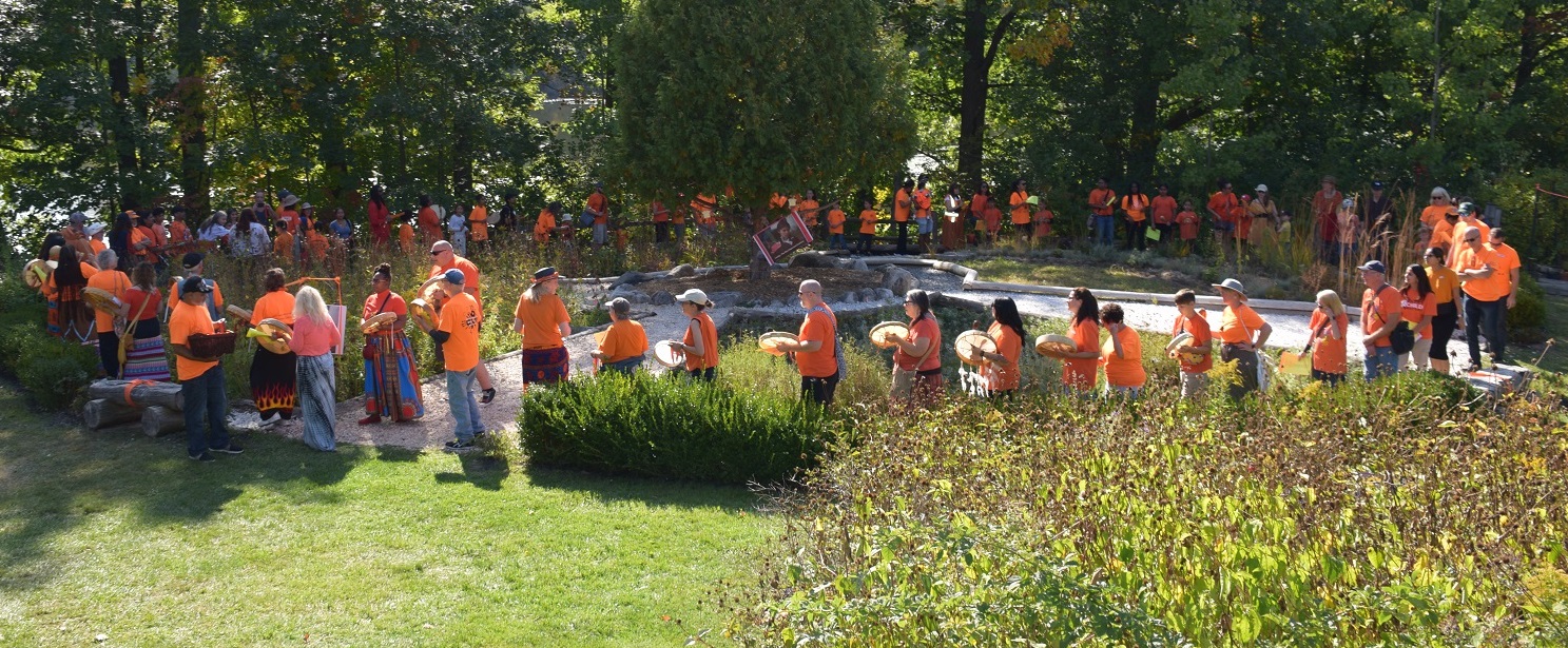 community members take part in a ceremony at the Medicine Wheel Garden at Heart Lake Conservation Park to commemorate the National Day for Truth and Reconciliation