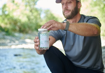 TRCA biologist conducts stream water quality monitoring in the field