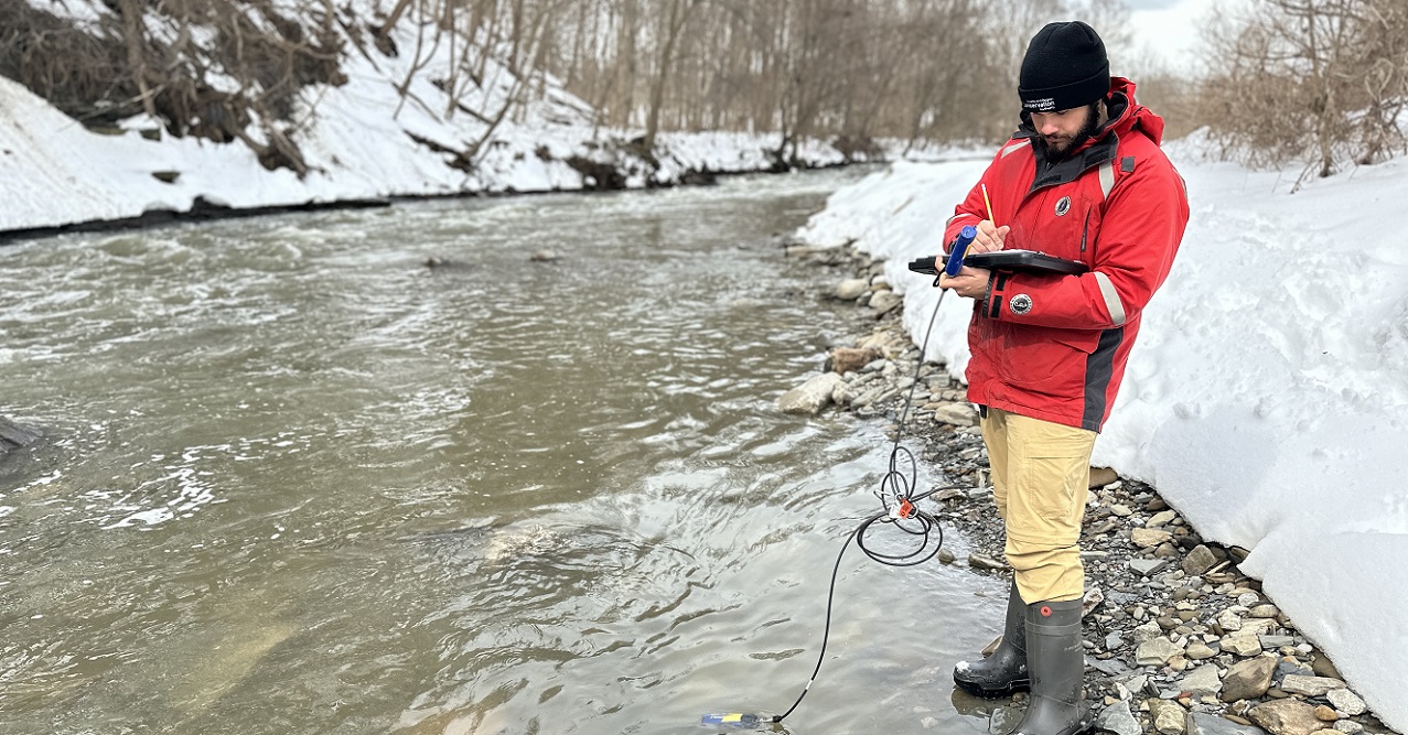 a TRCA team member conducts water quality monitoring