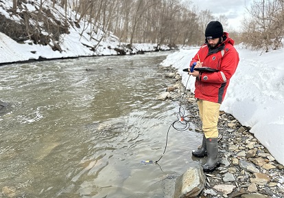 a TRCA team member conducts water quality monitoring