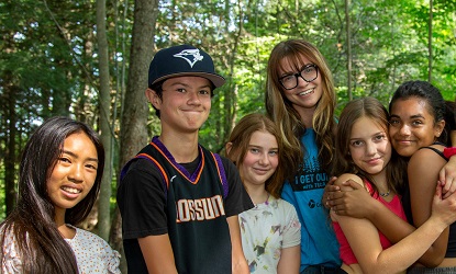 overnight summer campers and a TRCA counsellor pose for a group photograph at Claremont Nature Centre