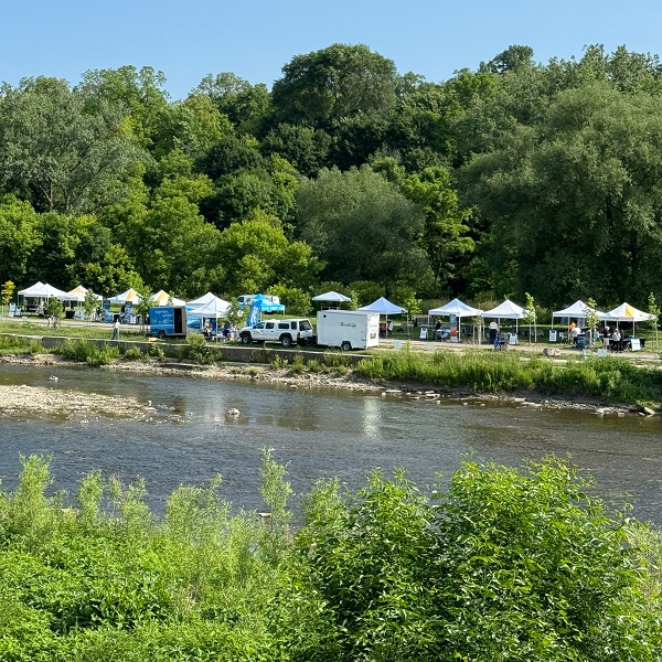 interactive activity booths line the banks of the Humber River at the 2025 TRCA Celebrate the Humber event