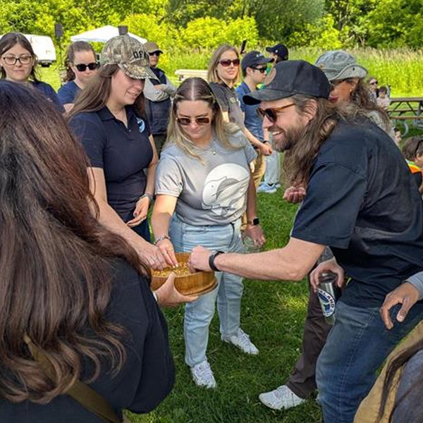 an Indigenous knowledge keeper and TRCA team members take part in a ceremony at the 2025 TRCA celebrate the Humber event