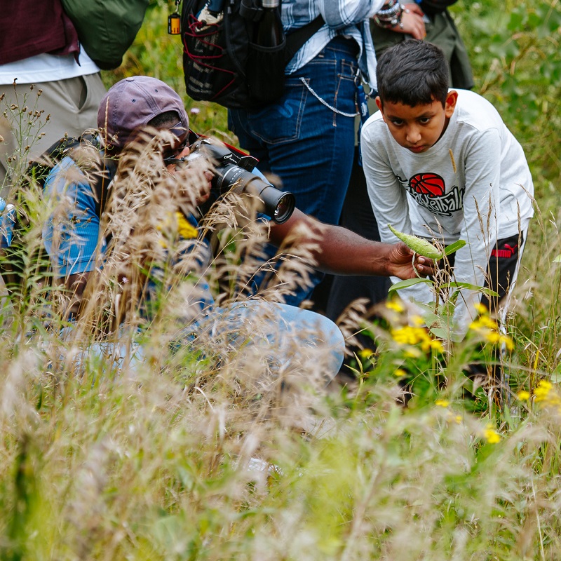 community members explore the trails at Tommy Thompson Park during the annual butterfly festival