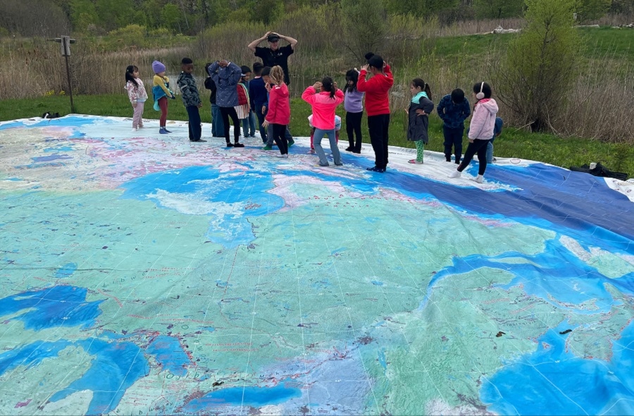 students explore the Giant Water Map to learn how creeks and rivers flow into Lake Ontario