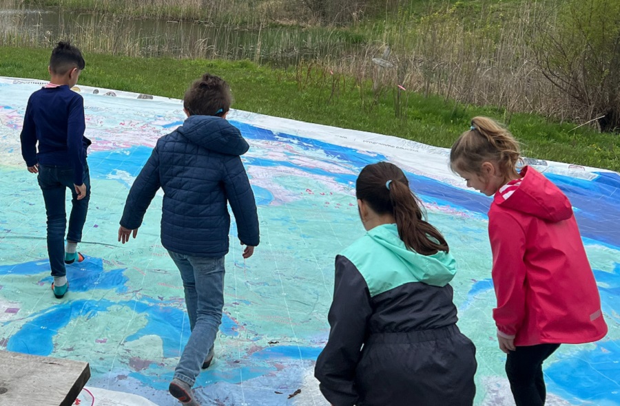 students explore the Giant Water Map to learn how creeks and rivers flow into Lake Ontario