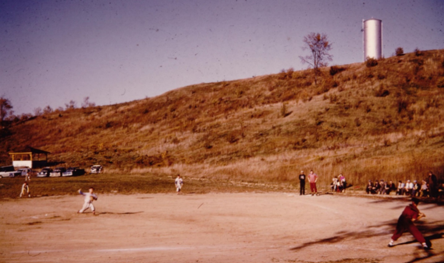 an archival photo from the 1950s of youngsters playing baseball in Bolton