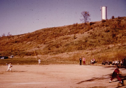 an archival photo from the 1950s of youngsters playing baseball in Bolton