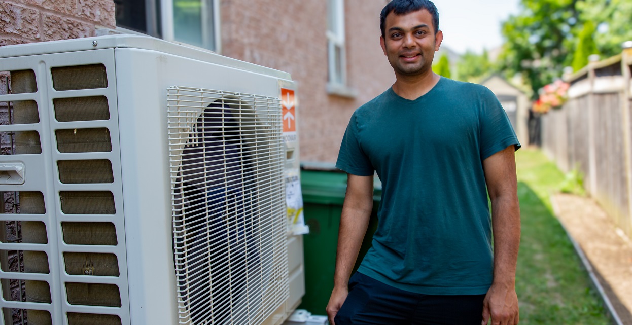 A Bolton resident installs a heat pump for his home