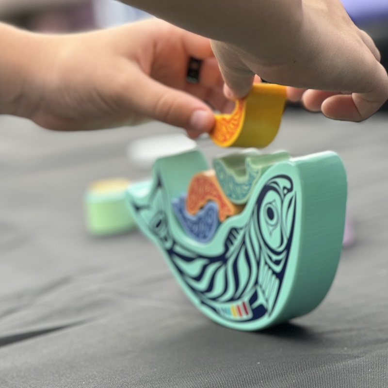 a young community member visits one of the many interactive stations at the TRCA Adventures of Salmon event at Morningside Park