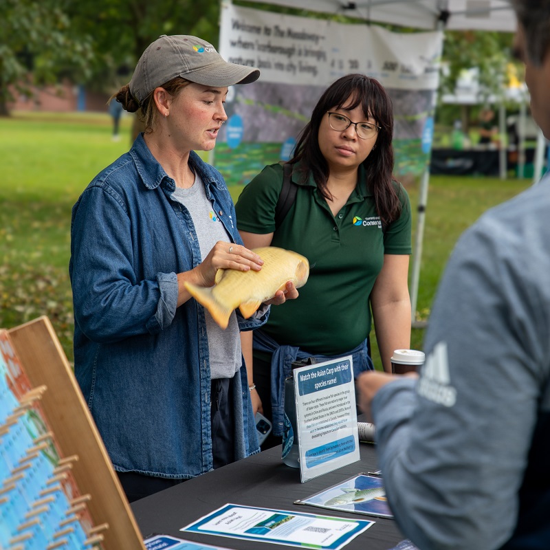 TRCA team members greet visitors at one of the many interactive stations at the Adventures of Salmon event at Morningside Park