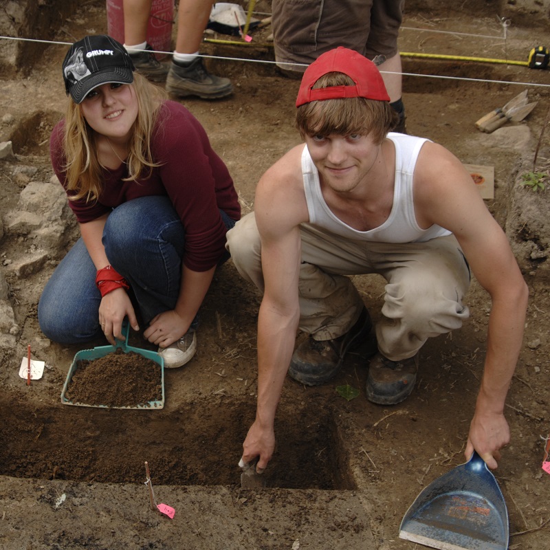 archival photograph of students taking part in a Boyd Archaeological Field School excavation