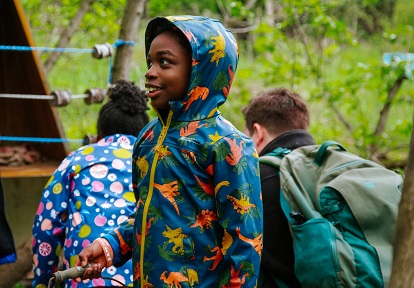 a student enjoys outdoor educational activities at a PA day camp at Kortright Centre for Conservation