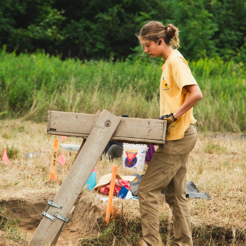 a student takes part in an excavation at the Boyd Archaeological Field School