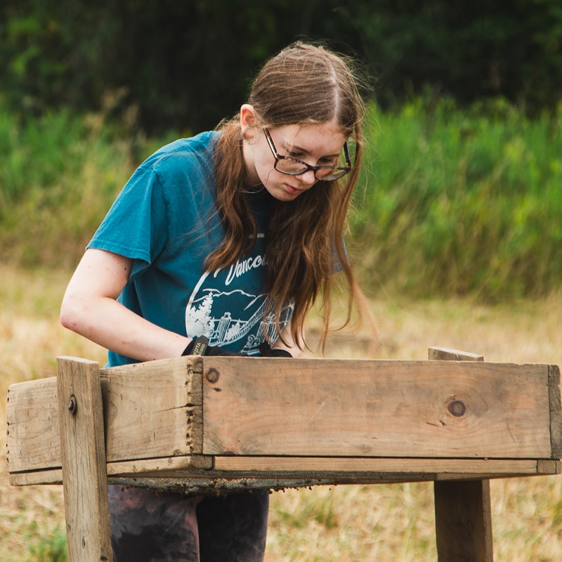 a student takes part in an excavation at the Boyd Archaeological Field School