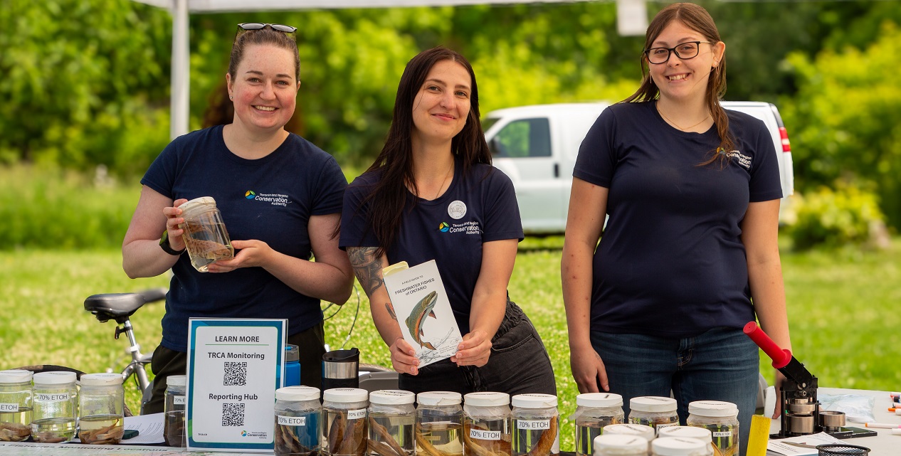 members of the TRCA ecosystem and climate science team host an interactive education booth at a community engagement event