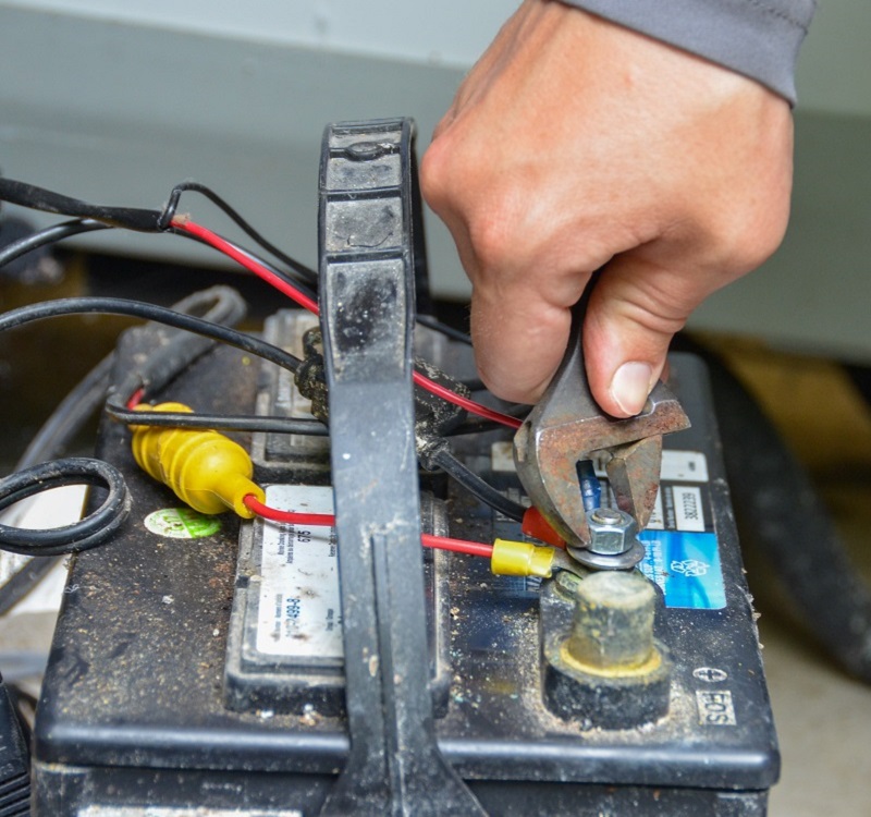 a member of the TRCA Real-Time Monitoring team performs maintenance on equipment used for stormwater monitoring