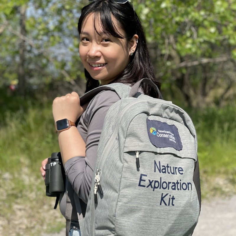 a visitor to Tommy Thompson Park carries a nature exploration kit backpack