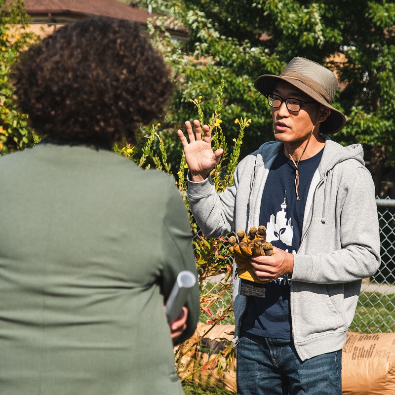 TRCA team members and dignitaries tour an urban agriculture project site in the Rexdale SNAP neighbourhood