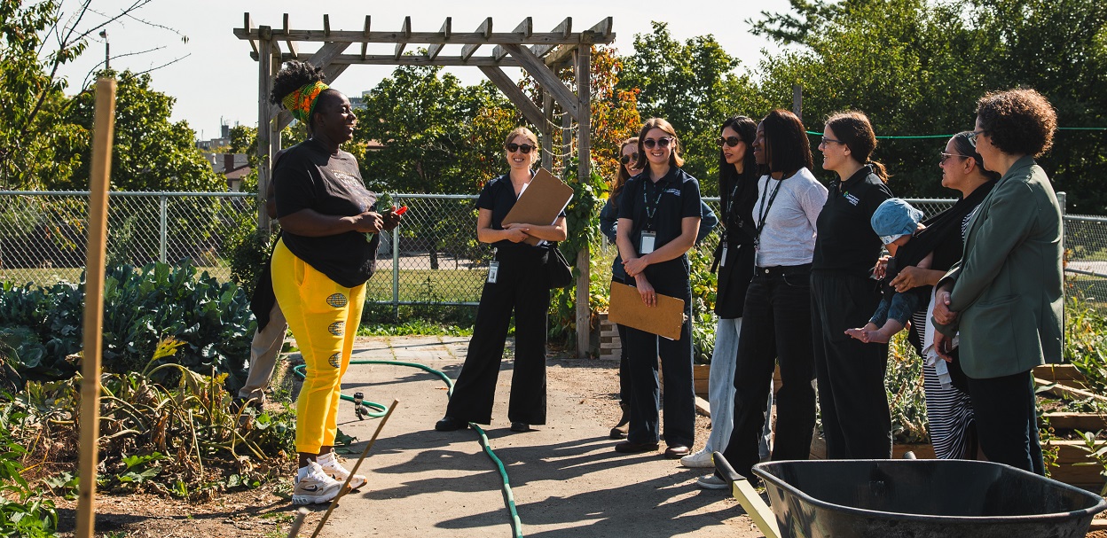 TRCA team members and dignitaries tour an urban agriculture project site in the Rexdale SNAP neighbourhood