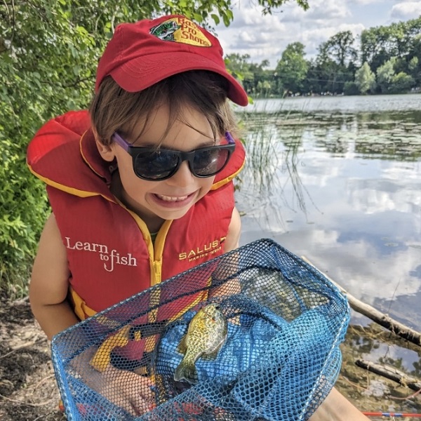 a youngster takes part in the Learn to Fish program at Heart lake Conservation Park