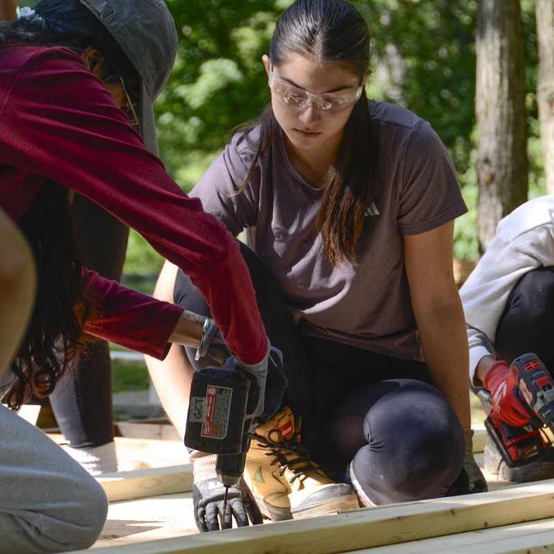 two Girls Can Too program participants work together on a construction project