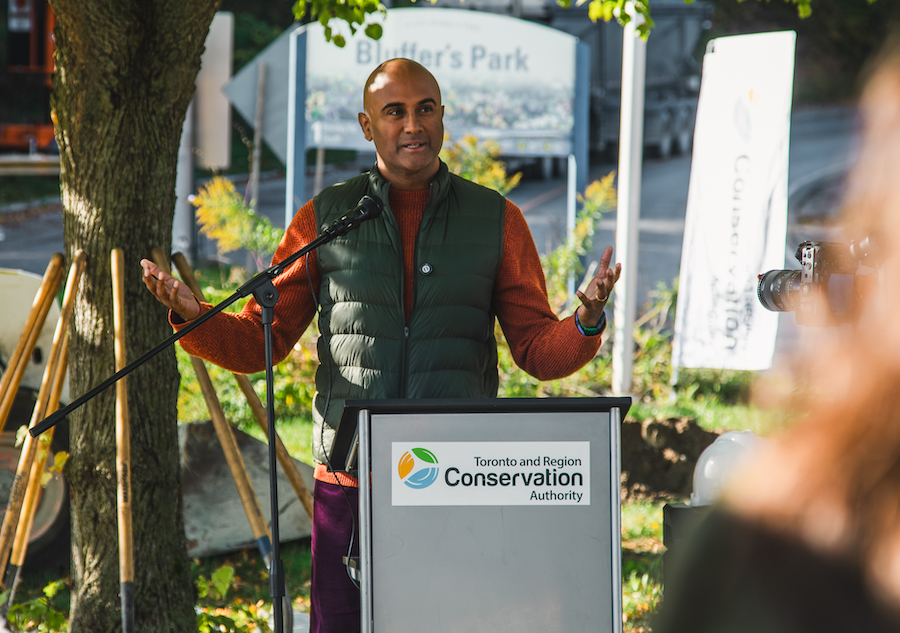 City Councillor Parthi Kandavel delivers remarks at the groundbreaking ceremony for the Brimley Road South Multi-Use Trail
