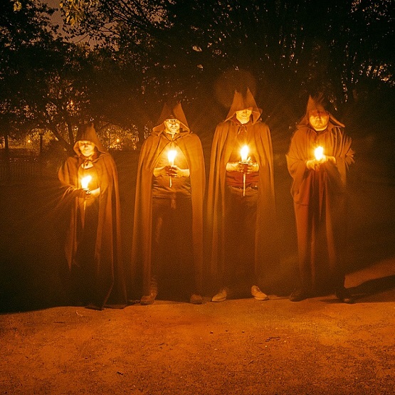 ominous hooded figures greet visitors to the Village at Black Creek as they prepare to play the Where Dark Things Dwell escape game