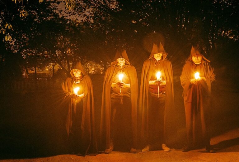 ominous hooded figures greet visitors to the Village at Black Creek as they prepare to play the Where Dark Things Dwell escape game