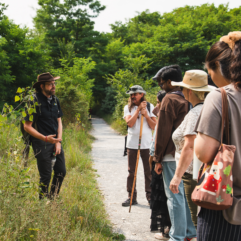 a TRCA educator leads a guided walk at Tommy Thompson Park