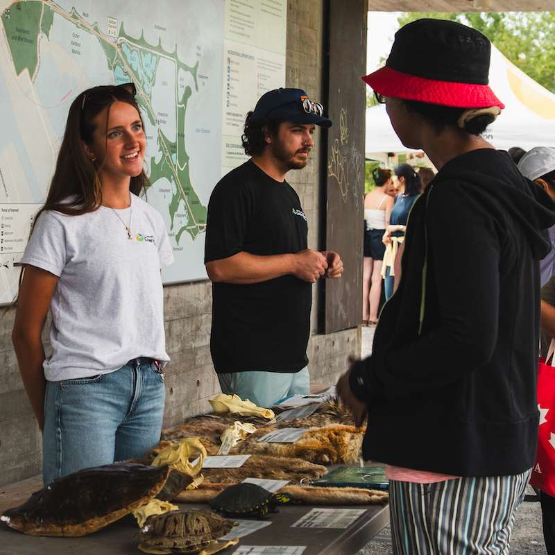 a TRCA team member hosts an interactive education booth at the butterfly festival at Tommy Thompson Park