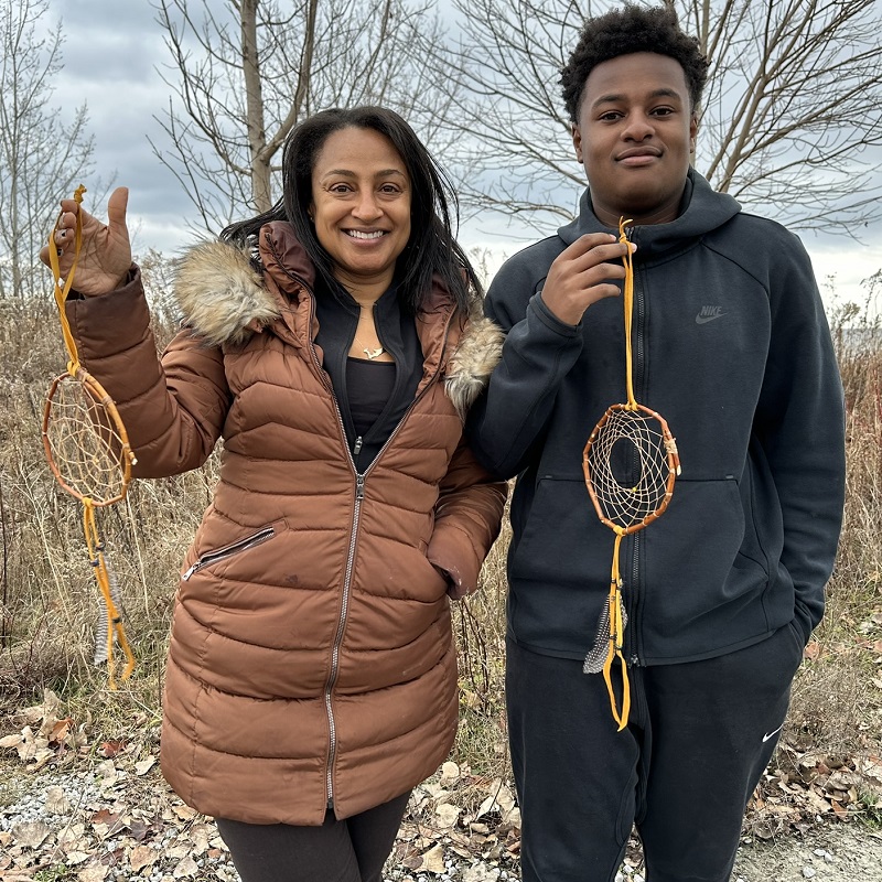 community members at a TRCA winter solstice workshop display hand crafted dreamcatchers