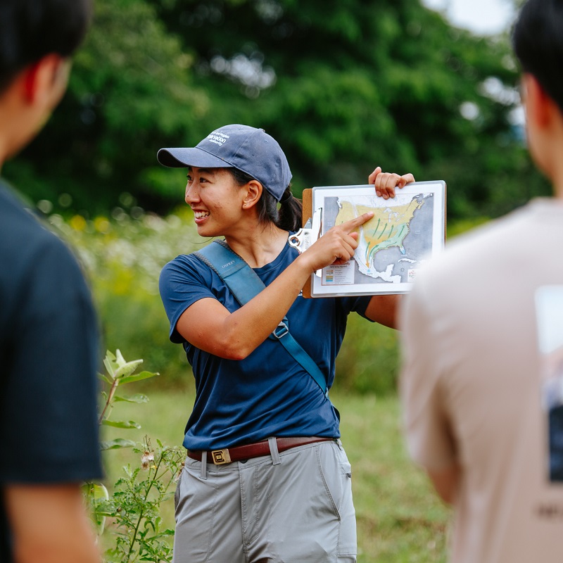a TRCA education team member leads a school field trip to a meadow habitat