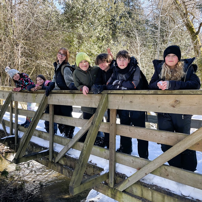 a teacher and students enjoy outdoor adventure at a TRCA March Break camp at Claremont Nature Centre