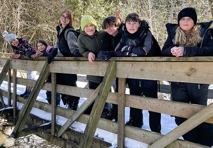 a teacher and students enjoy outdoor adventure at a TRCA March Break camp at Claremont Nature Centre